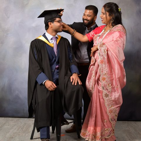 Rahul with his parents at his graduation